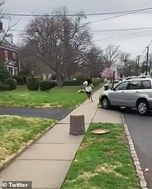 The shocking footage showed the SUV turn off a road before accelerating over the sidewalk as the victim runs away in terror