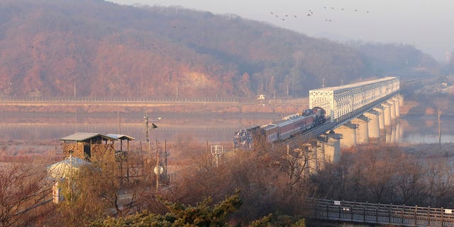 A South Korean train runs on the rail track, which the two Koreas hope to eventually use as an international transport link, near to the border village of Panmunjom in North Korea, in Paju, South Korea, Friday, Nov. 30, 2018.  (AP Photo/Ahn Young-joon)