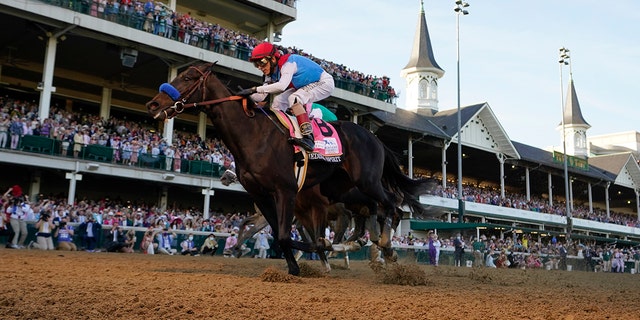 FILE - John Velazquez riding Medina Spirit crosses the finish line to win the 147th running of the Kentucky Derby at Churchill Downs in Louisville, Ky., in this Saturday, May 1, 2021, file photo. 
