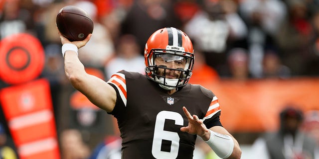 Cleveland Browns quarterback Baker Mayfield throws during the first half of an NFL football game against the Arizona Cardinals, Sunday, Oct. 17, 2021, in Cleveland.