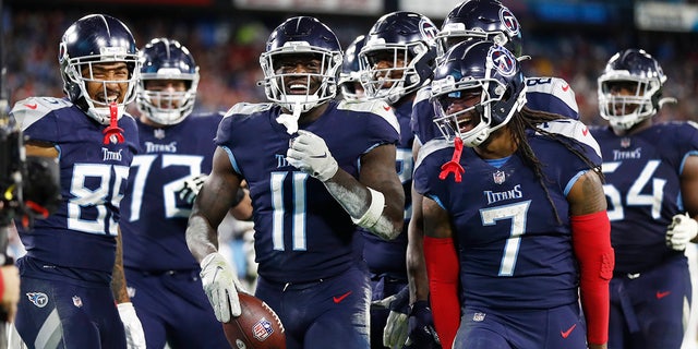 Tennessee Titans wide receiver A.J. Brown (11) celebrates after scoring a touchdown against the San Francisco 49ers in the second half of an NFL football game Thursday, Dec. 23, 2021, in Nashville, Tenn.