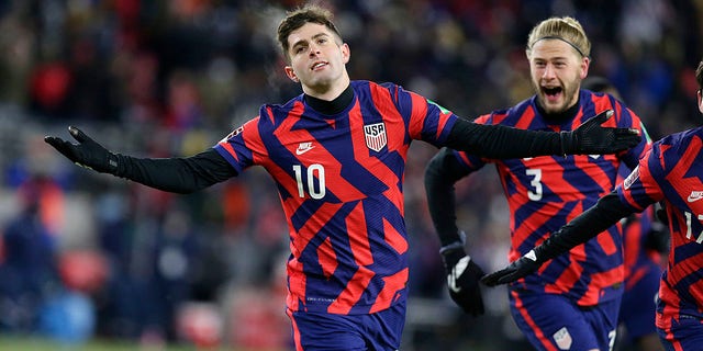 The United States' Christian Pulisic (10) celebrates a goal with Walker Zimmerman (3) during the team's FIFA World Cup qualifying soccer match against Honduras Feb. 2, 2022, in St. Paul, Minn.