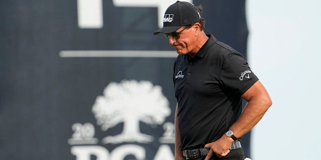 Phil Mickelson walks off the 14th green after missing a birdie putt during the third round at the PGA Championship golf tournament on the Ocean Course, Saturday, May 22, 2021, in Kiawah Island, S.C.