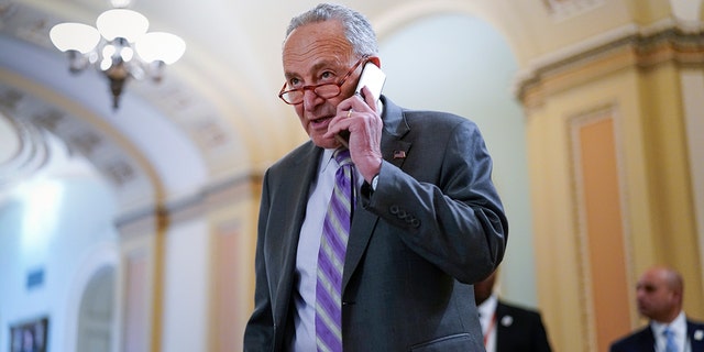 Senate Majority Leader Chuck Schumer, D-N.Y., arrives for a weekly policy luncheon at the Capitol in Washington March 8, 2022. 