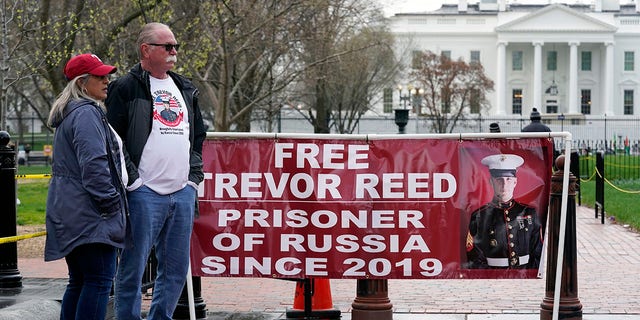 Joey and Paula Reed, parents of U.S. Marine Corps veteran and Russian prisoner Trevor Reed, stand in Lafayette Park near the White House March 30, 2022.