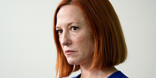 White House press secretary Jen Psaki listens as Council of Economic Advisers member Jared Bernstein speaks during a press briefing at the White House, Friday, April 1, 2022, in Washington.