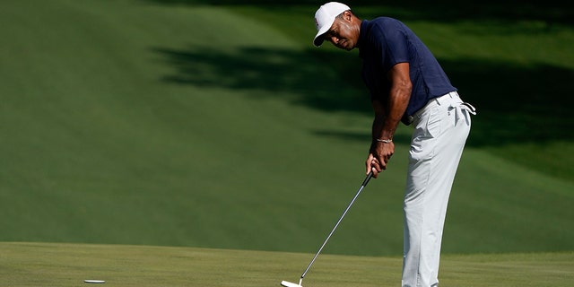 Tiger Woods putts on the fourth green during a practice round for the Masters golf tournament on Monday, April 4, 2022, in Augusta, Ga.