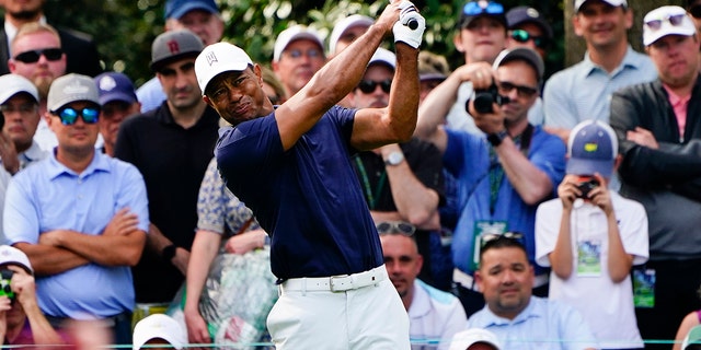 Tiger Woods tees off on the seventh hole during a practice round for the Masters golf tournament on Monday, April 4, 2022, in Augusta, Ga.