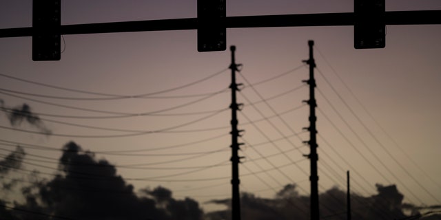 Traffic lights are out of service on a street in San Juan, Puerto Rico, early Thursday, April 7, 2022. 