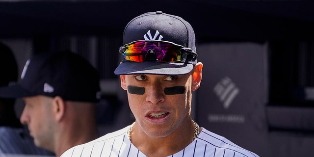 New York Yankees right fielder Aaron Judge stands in the dugout before the Yankees opening day game against the Boston Red Sox, Friday, April 8, 2022, in New York.