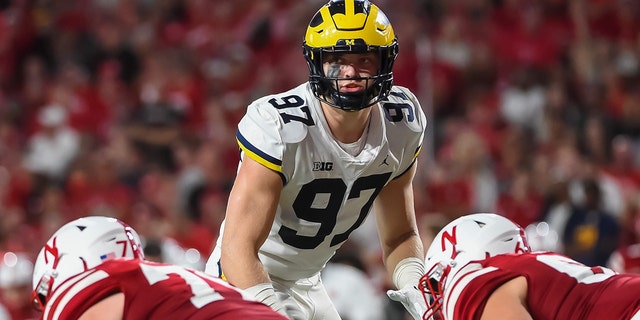 Defensive end Aidan Hutchinson #97 of the Michigan Wolverines looks over the line against the Nebraska Cornhuskers in the first half at Memorial Stadium on Oct. 9, 2021 in Lincoln, Nebraska.