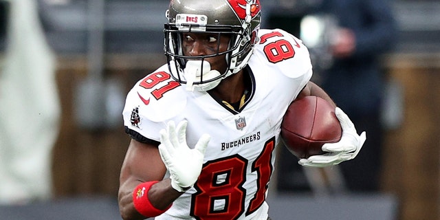 Antonio Brown #81 of the Tampa Bay Buccaneers carries the ball against the defense of the New York Jets in the third quarter of the game at MetLife Stadium on January 02, 2022 in East Rutherford, New Jersey.