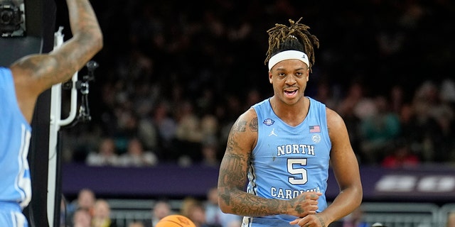 North Carolina forward Armando Bacot celebrates after scoring against Kansas during the first half of a college basketball game in the finals of the Men's Final Four NCAA tournament, Monday, April 4, 2022, in New Orleans.