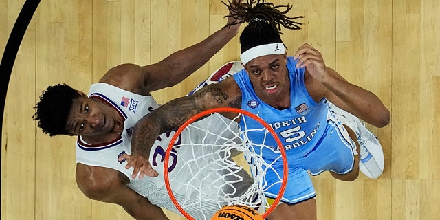 North Carolina forward Armando Bacot shoots over Kansas forward David McCormack during the second half of a college basketball game in the finals of the Men's Final Four NCAA tournament, Monday, April 4, 2022, in New Orleans.