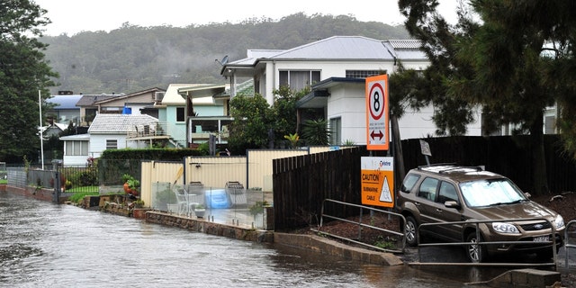 Houses are seen on the bank of overflowing Woronora River on April 7, 2022.