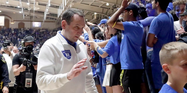 Duke coach Mike Krzyzewski walks off the floor following a tribute in his honor after the team's NCAA game against North Carolina March 5, 2022, in Durham, N.C. 