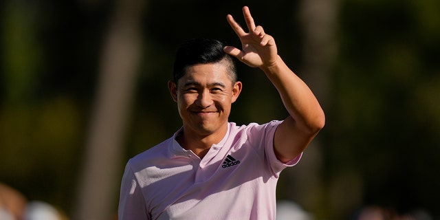 Collin Morikawa celebrates after holing out on the 18th hole for a birdie during the final round at the Masters golf tournament on Sunday, April 10, 2022, in Augusta, Ga.