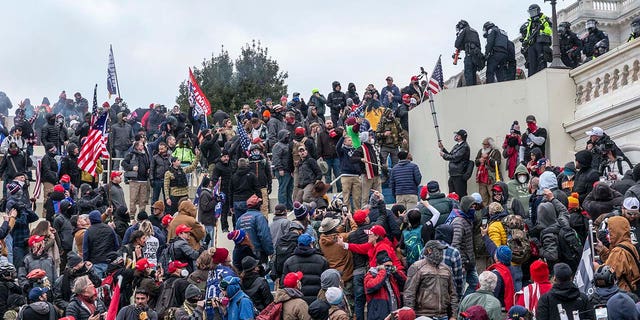 Protesters seen all over Capitol building where pro-Trump supporters riot and breached the Capitol. 