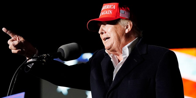 Former President Donald Trump points to the crowd as he speaks at a rally on Jan. 15, 2022, in Florence, Ariz. 