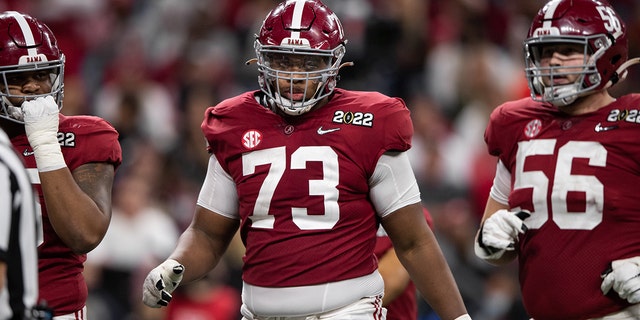 Alabama Crimson Tide OL Evan Neal (73) walks down the field during the Alabama Crimson Tide versus the Georgia Bulldogs in the College Football Playoff National Championship, on January 10, 2022, at Lucas Oil Stadium in Indianapolis, IN.