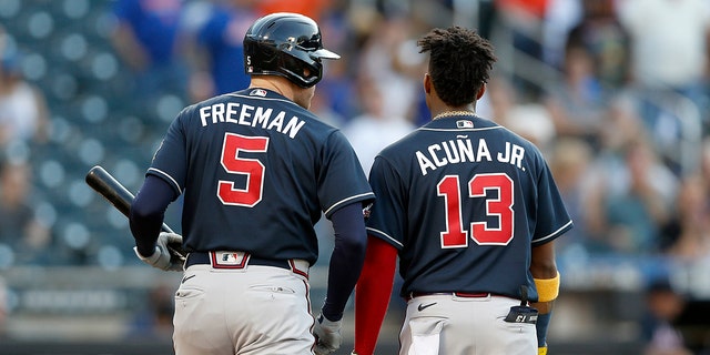 Freddie Freeman #5 and Ronald Acuna Jr. #13 of the Atlanta Braves in action against the New York Mets at Citi Field on June 21, 2021 in New York City. The Mets defeated the Braves 4-2. 