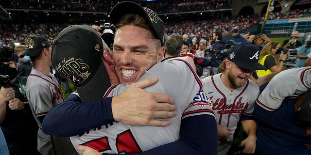 Atlanta Braves relief pitcher Will Smith and first baseman Freddie Freeman celebrate after winning baseball's World Series in Game 6 against the Houston Astros Tuesday, Nov. 2, 2021, in Houston. The Braves won 7-0.