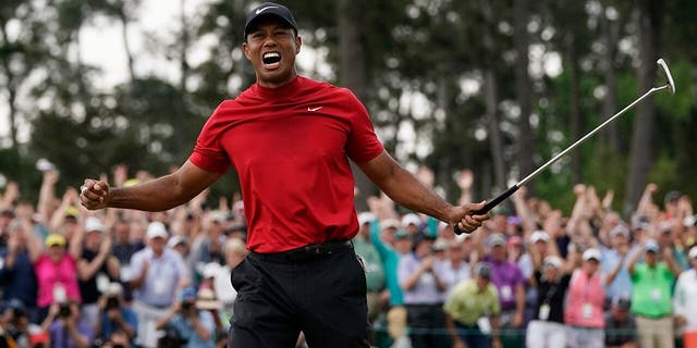 FILE - In this April 14, 2019, file photo, Tiger Woods reacts as he wins the Masters golf tournament in Augusta, Ga. Woods' appeal worldwide, particularly in Asia, remains stronger than ever after his 15th major title