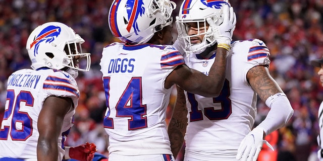 Buffalo Bills wide receiver Gabriel Davis (13) celebrates with teammate Stefon Diggs (14) after catching a 19-yard touchdown pass during the second half of an NFL divisional round playoff football game against the Kansas City Chiefs, Sunday, Jan. 23, 2022, in Kansas City, Mo.