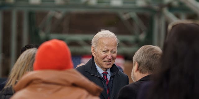 President Joe Biden greets people after delivering a speech on infrastructure while visiting the bridge along NH 175 spanning the Pemigewasset River on November 16, 2021, in Woodstock, New Hampshire. 