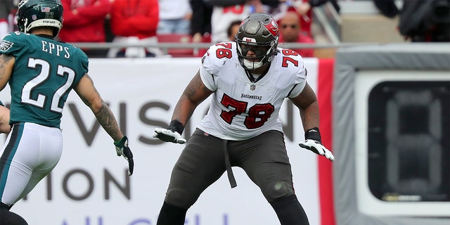 Tampa Bay Buccaneers Offensive Tackle Tristan Wirfs (78) pass blocks during the NFL Wild Card game between the Philadelphia Eagles and the Tampa Bay Buccaneers on January 16, 2022 at Raymond James Stadium in Tampa, Florida. 