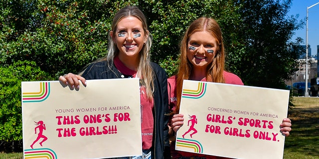 ATLANTA, GA - MARCH 17:  Members of Young Women For America protest transgender swimmer Lia Thomas at the NCAA Swimming and Diving Championships on March 17th, 2022 at the McAuley Aquatic Center in Atlanta Georgia.