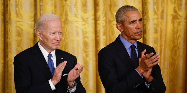 WASHINGTON, DC - APRIL 5: U.S. President Joe Biden and former President Barack Obama attend an event to mark the 2010 passage of the Affordable Care Act in the East Room of the White House on April 5, 2022 in Washington, D.C.