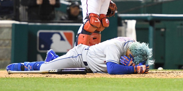 Francisco Lindor #12 of the New York Mets lies on the ground after getting by a pitch in the fifth inning during a baseball game against the Washington Nationals at the Nationals Park on April 8, 2022, in Washington, DC.  