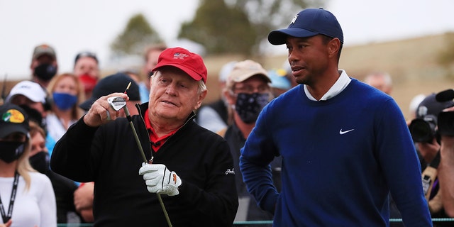 Jack Nicklaus talks to Tiger Woods of the United States on the 19th tee during the Payne’s Valley Cup on Sept. 22, 2020 on the Payne’s Valley course at Big Cedar Lodge in Ridgedale, Missouri.