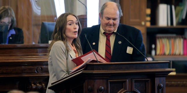 Kansas state Reps. Kristey Williams, left, R-August, and Clarke Sanders, right, R-Salina, debate a proposal to make it easier for parents to challenge materials in public school classrooms and libraries, Friday, April 1, 2022, at the Statehouse in Topeka, Kan. Both support the measure, which backers call "The Parents Bill of Rights." 