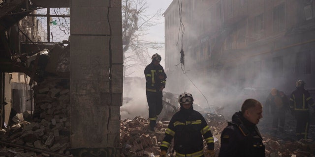 Firefighters work to extinguish multiple fires after a Russian attack in Kharkiv, Ukraine, Saturday, April 16, 2022. 