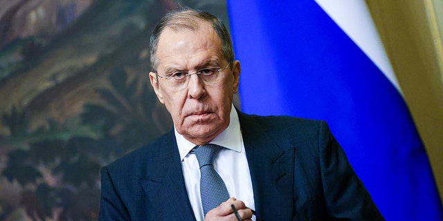 Russian Foreign Minister Sergey Lavrov pauses during a news conference in Moscow on Nov. 30, 2021.