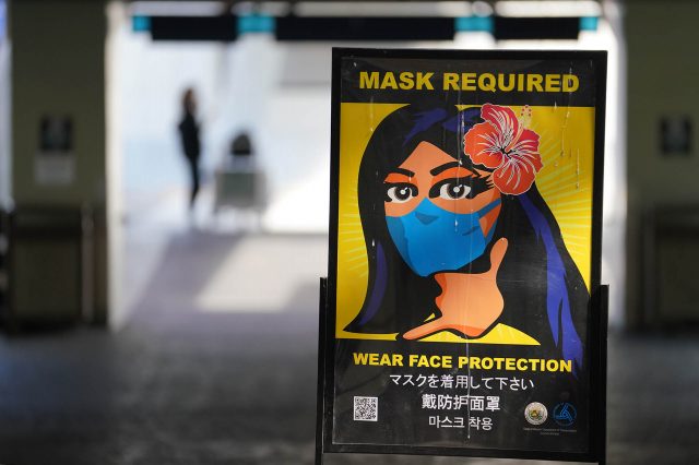 Mask required sign at the Daniel K. Inouye International Airport.
