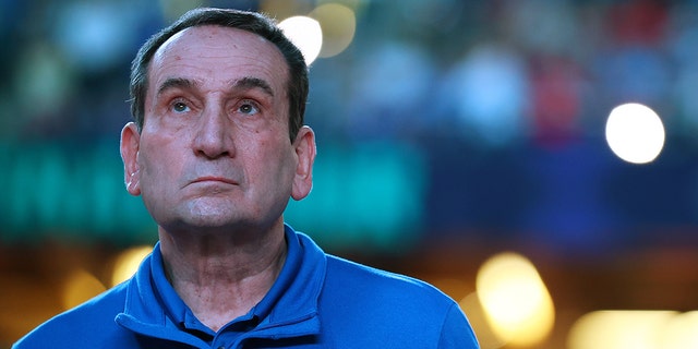 Head coach Mike Krzyzewski of the Duke Blue Devils looks to the crowd before taking on the North Carolina Tar Heels in the semifinal game of the 2022 NCAA Men's Basketball Tournament Final Four at Caesars Superdome on April 02, 2022 in New Orleans, Louisiana.