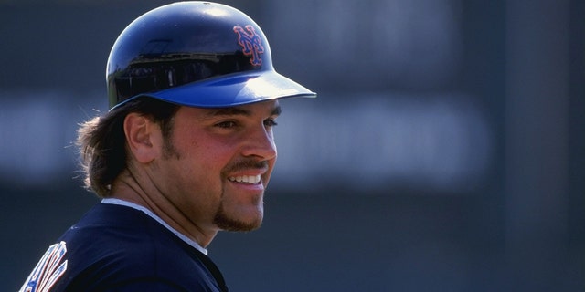 Catcher Mike Piazza of the New York Mets looks on the field during the Spring Training game against the Atlanta Braves at the Disney''s Wide World of Sports Complex in Kissimmee, Florida. 