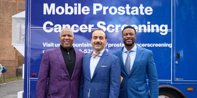 Members of Mt. Sinai Hospital Service's new mobile cancer unit pose in front of the bus