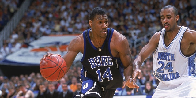 Nate James of the Duke Blue Devils moves with the ball around Max Owens of the North Carolina Tar Heels during the ACC Tournament Game at the Georgia Dome in Atlanta, Georgia. The Blue Devils defeated the Tar Heels 79-53.