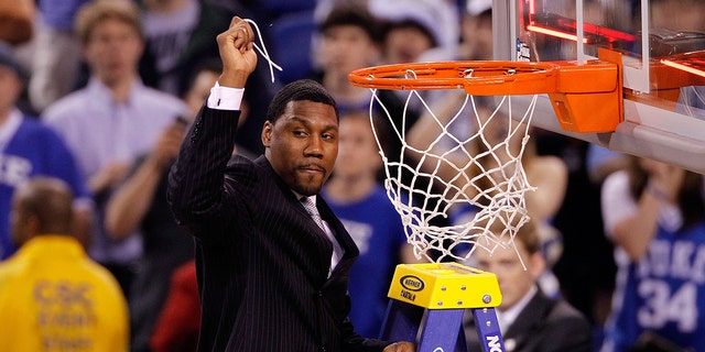 Assistant coach Nate James of the Duke Blue Devils celebrates after he cut down a piece of the net following their 61-59 win against the Butler Bulldogs during the 2010 NCAA Division I Men's Basketball National Championship game at Lucas Oil Stadium on April 5, 2010 in Indianapolis, Indiana.