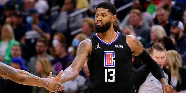 Los Angeles Clippers guard Paul George celebrates during the fourth quarter of the team's play-in game against the Minnesota Timberwolves Tuesday, April 12, 2022, in Minneapolis.