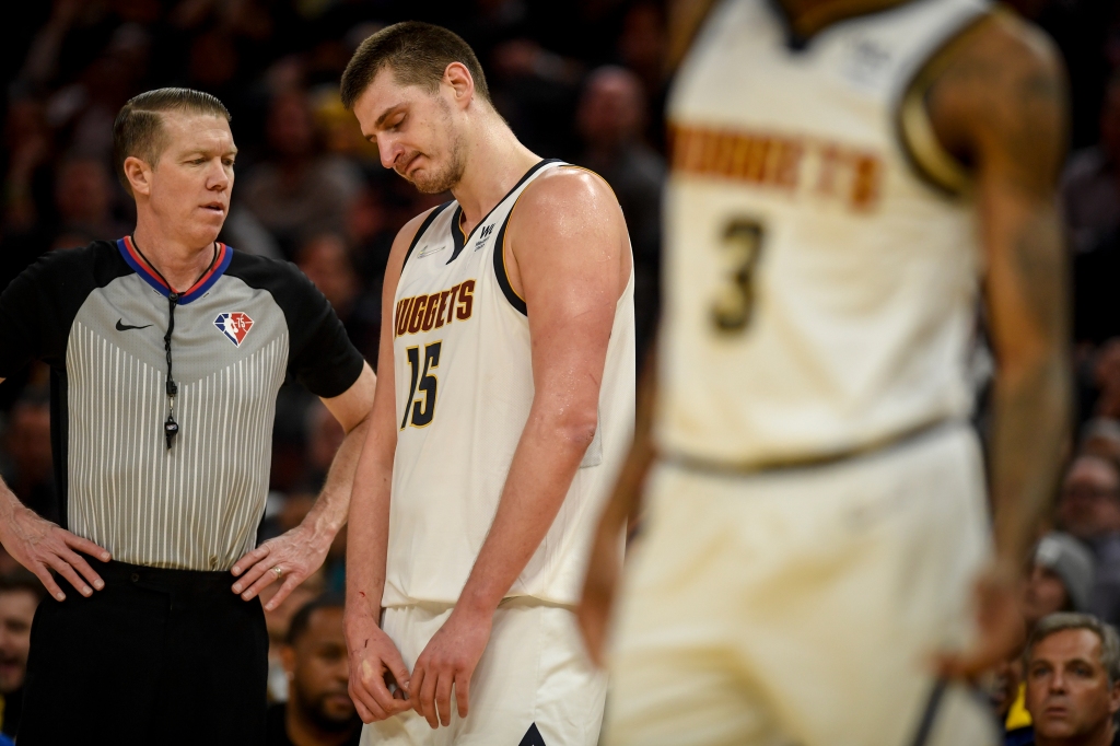 Kiszla: Nuggets center Nikola Jokic can’t beat five Warriors and three refs all by himself in blowout playoff loss