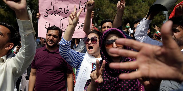 Supporters of ruling party Pakistan Tehreek Insaf chant slogans during a protest in Islamabad, Pakistan, Sunday, April 3, 2022.