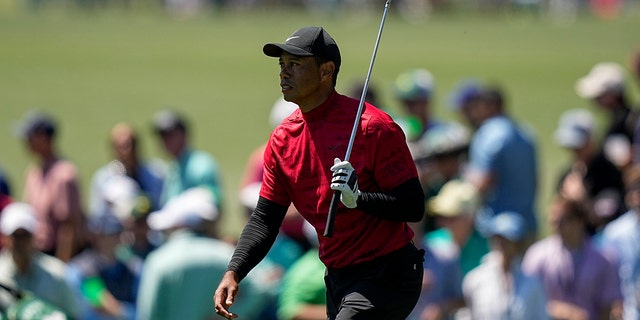 Tiger Woods walks up the ninth fairway during the final round at the Masters golf tournament on Sunday, April 10, 2022, in Augusta, Ga.