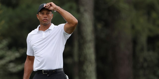 Tiger Woods of the United States looks on over the 18th hole during a practice round prior to the Masters at Augusta National Golf Club on April 06, 2022 in Augusta, Georgia.