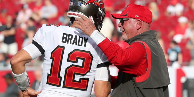 Tampa Bay Buccaneers Quarterback Tom Brady (12) greets Head Coach Bruce Arians before the regular season game between the Carolina Panthers and the Tampa Bay Buccaneers on Jan. 9, 2022 at Raymond James Stadium in Tampa, Florida.