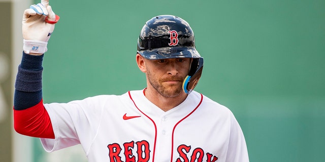 Trevor Story of the Boston Red Sox reacts after hitting a single during a spring training game against the Atlanta Braves on March 30, 2022, at jetBlue Park at Fenway South in Fort Myers, Florida.